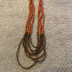 Pink and gold bead necklace